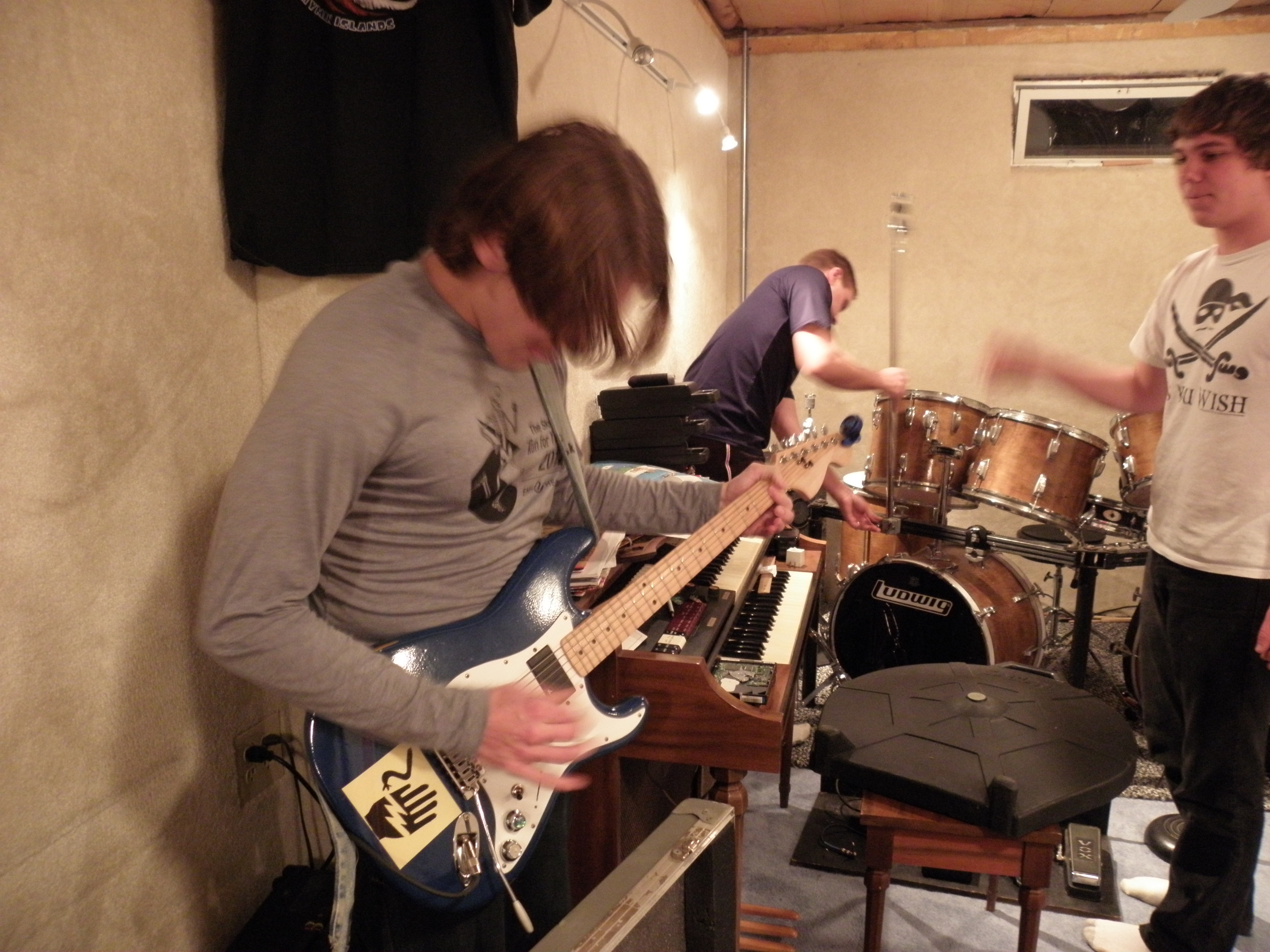 After chilli dogs we started setting up band practice. Conner loaned me a guitar and Tyler set up the drums.