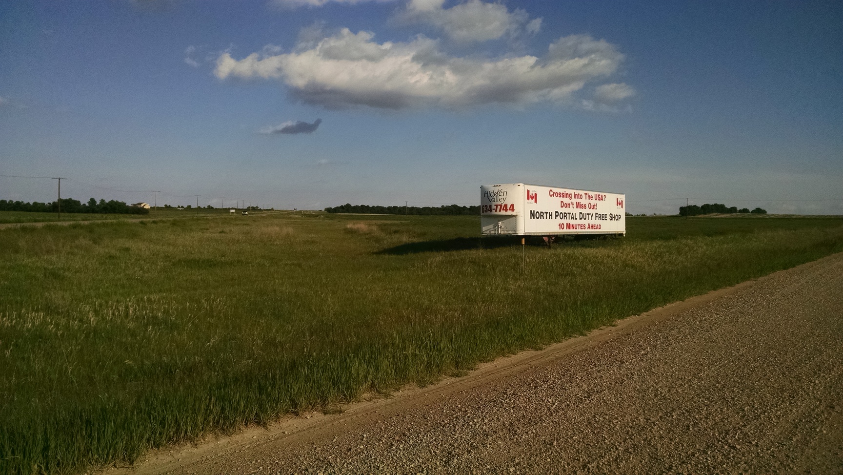 Entering USA shortly. I would have stopped for a picture of the real sign but I was pretty worried about my bike at the time.