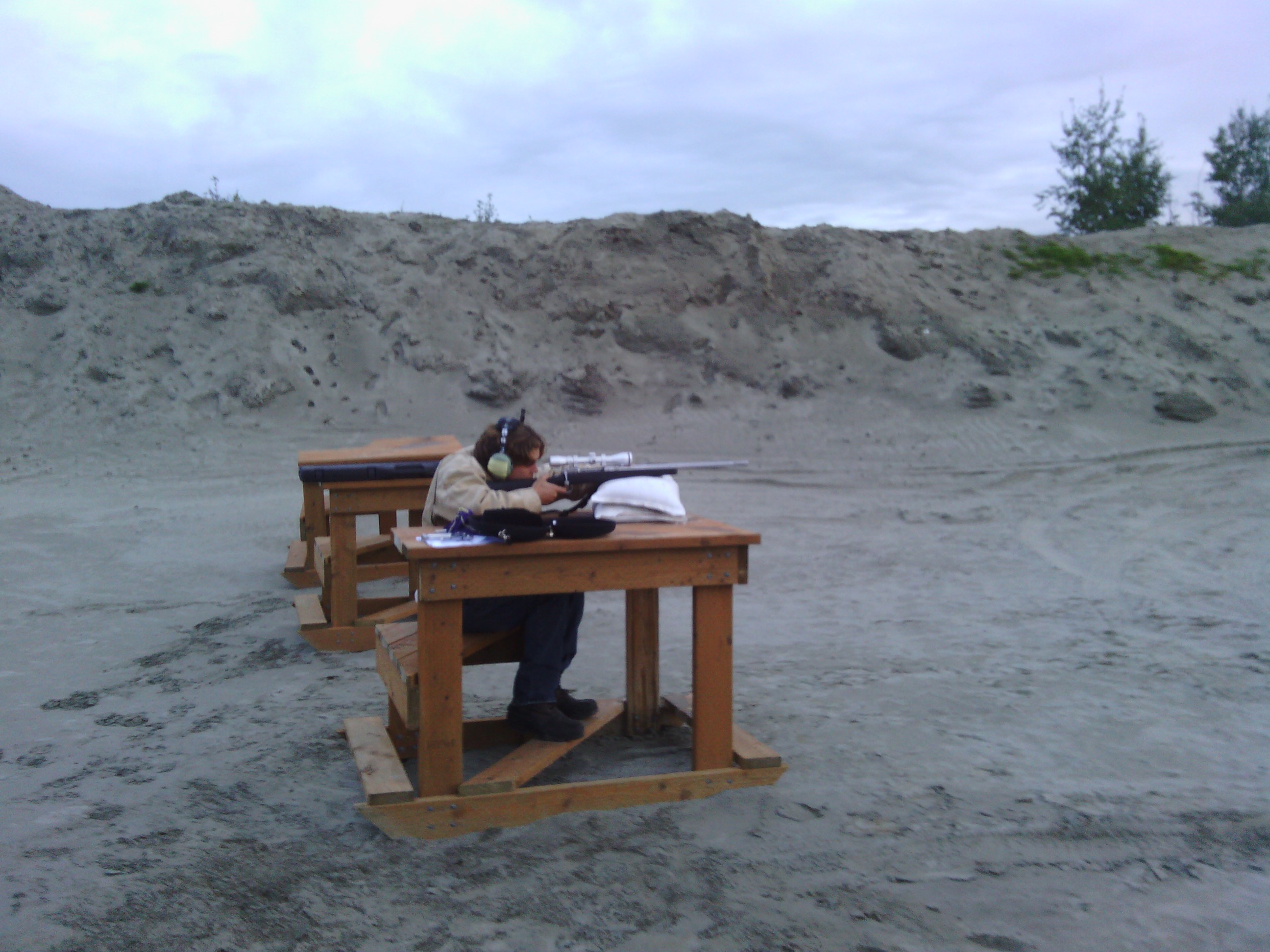 Shooting a rifle at the sand pits. (with an airplane headset to cover my ears)