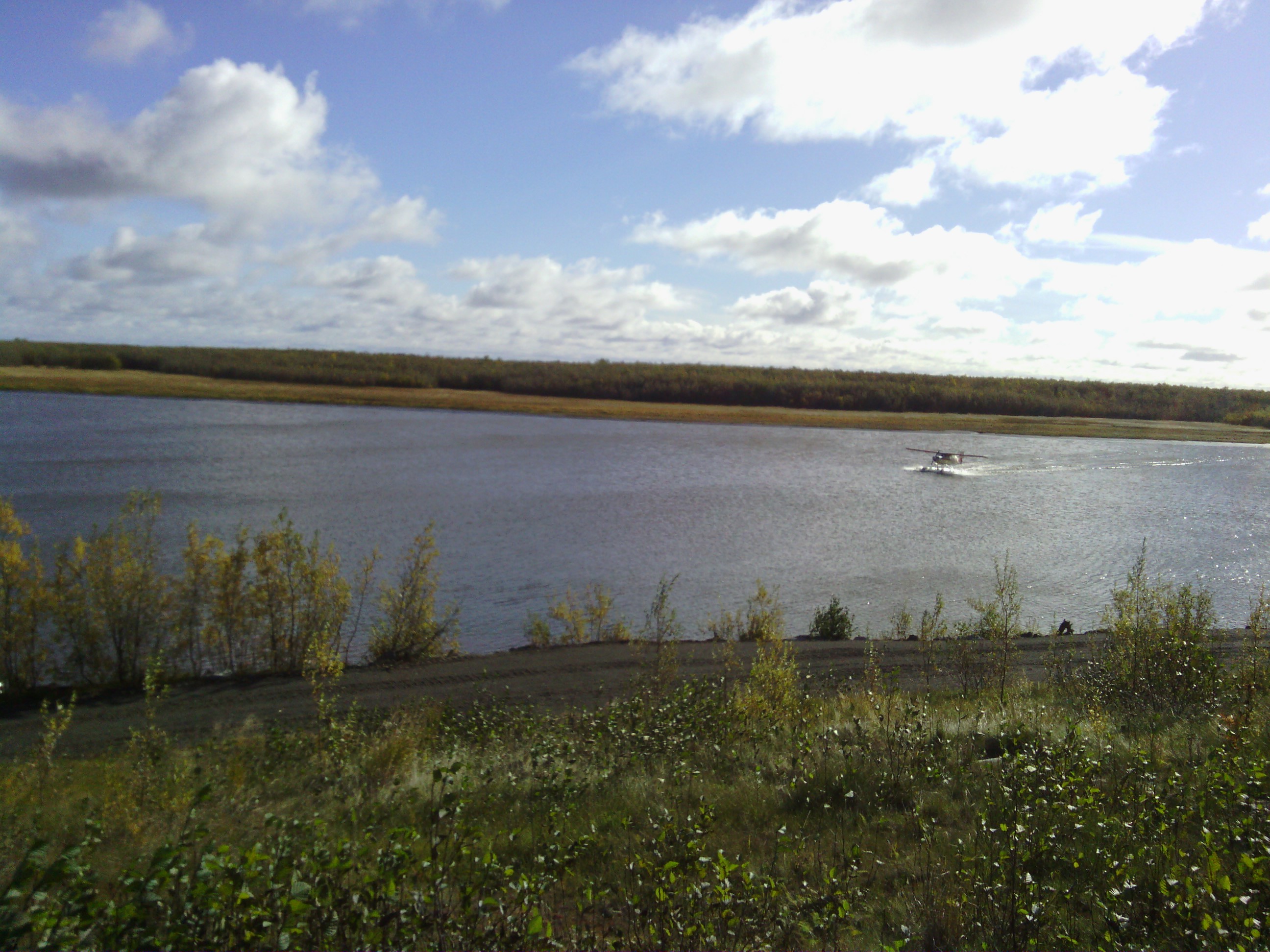 Float plane landing on the Kuskokwim river