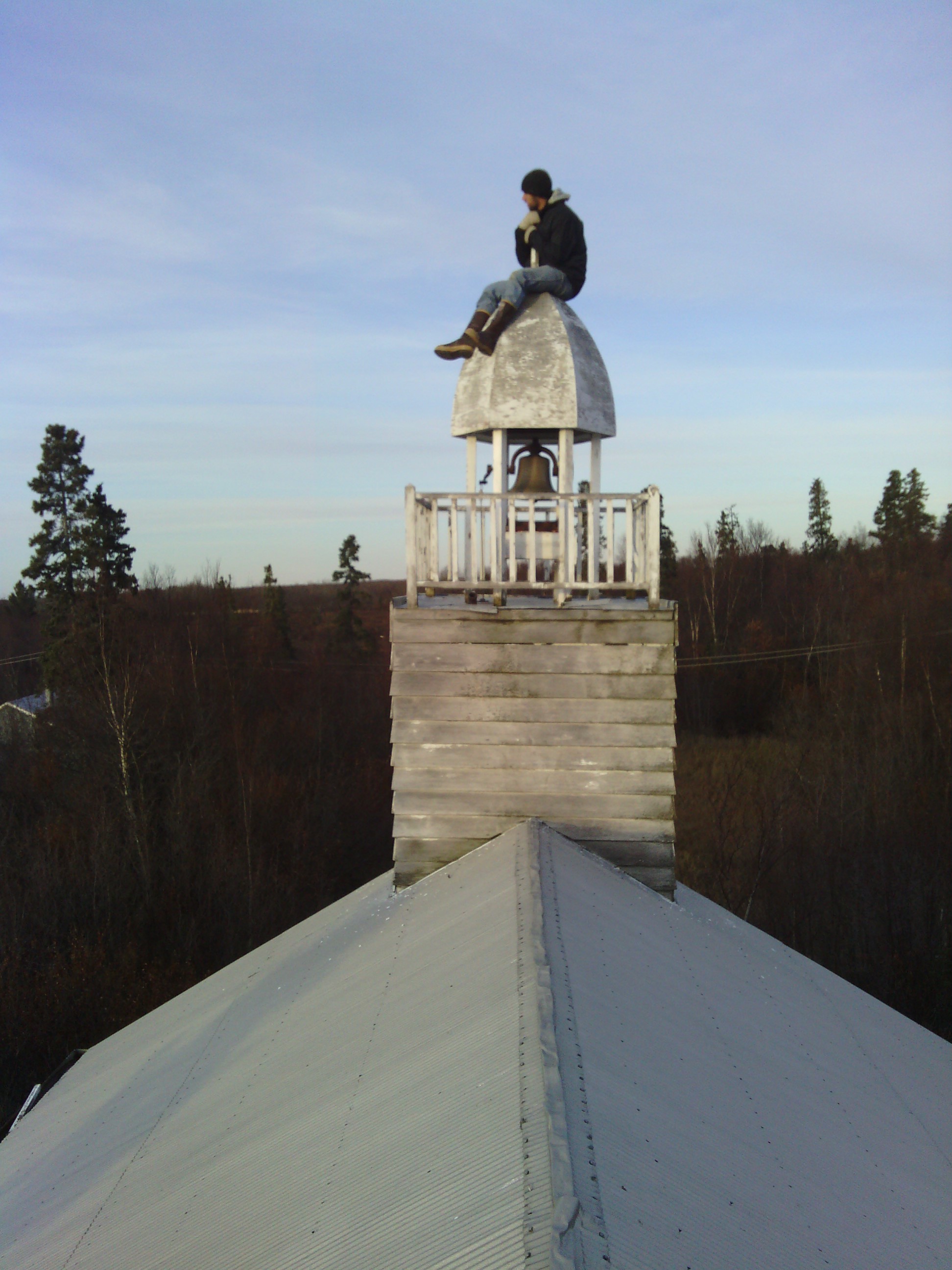 Nate on top of the chapel&rsquo;s steeple