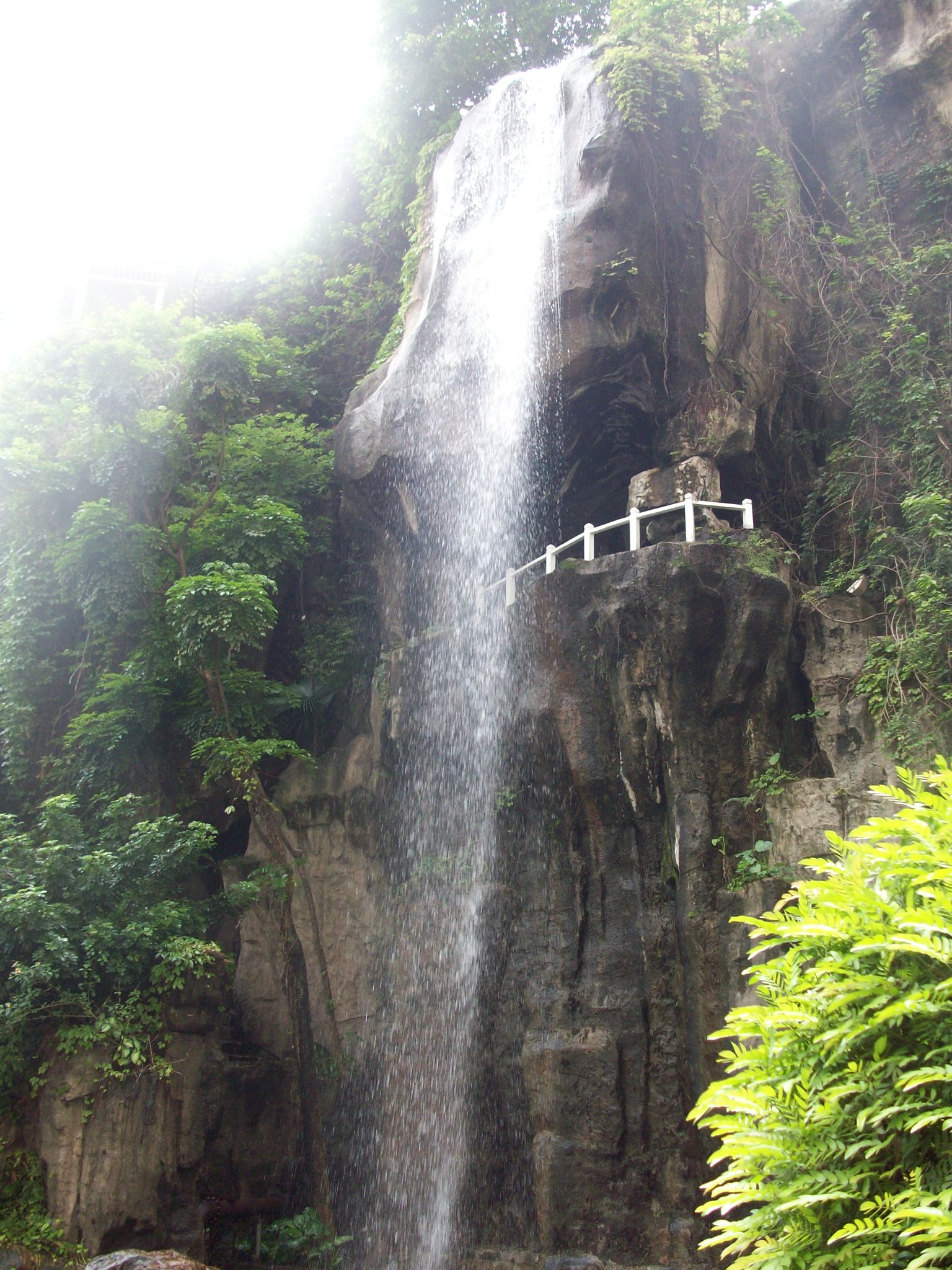I started at the Garden Hotel to check on long-distance bus prices.  This waterfall is in their courtyard.