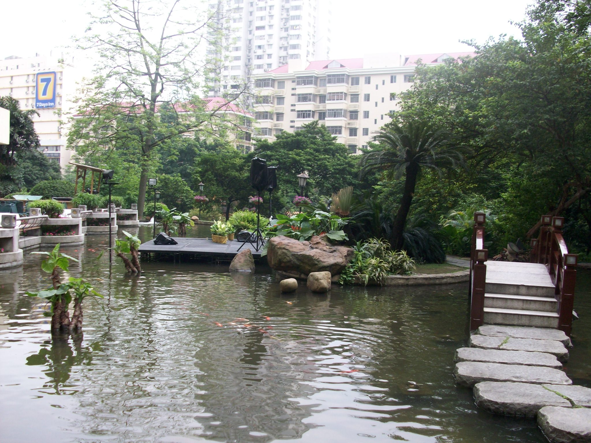 The waterfall goes into this pond. I crossed that bridge before they realized I didn&rsquo;t have a room at the hotel and threw me out