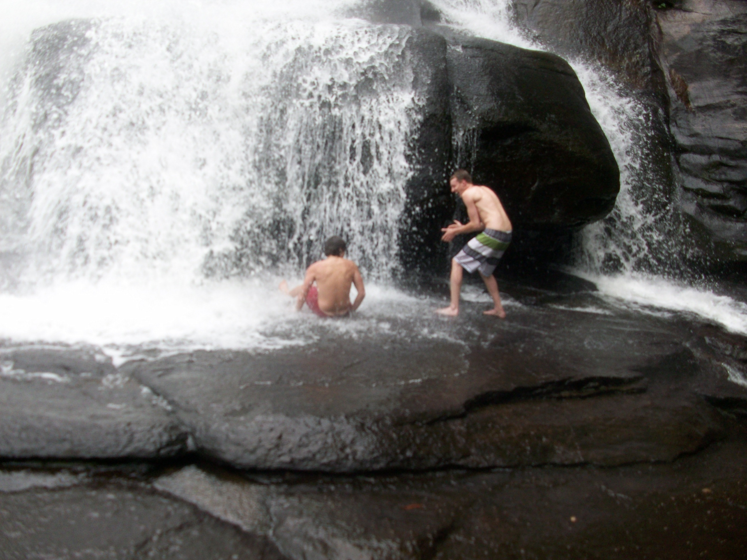 We were moving closer to get under the falls, but it was slippery and I fell on my butt.