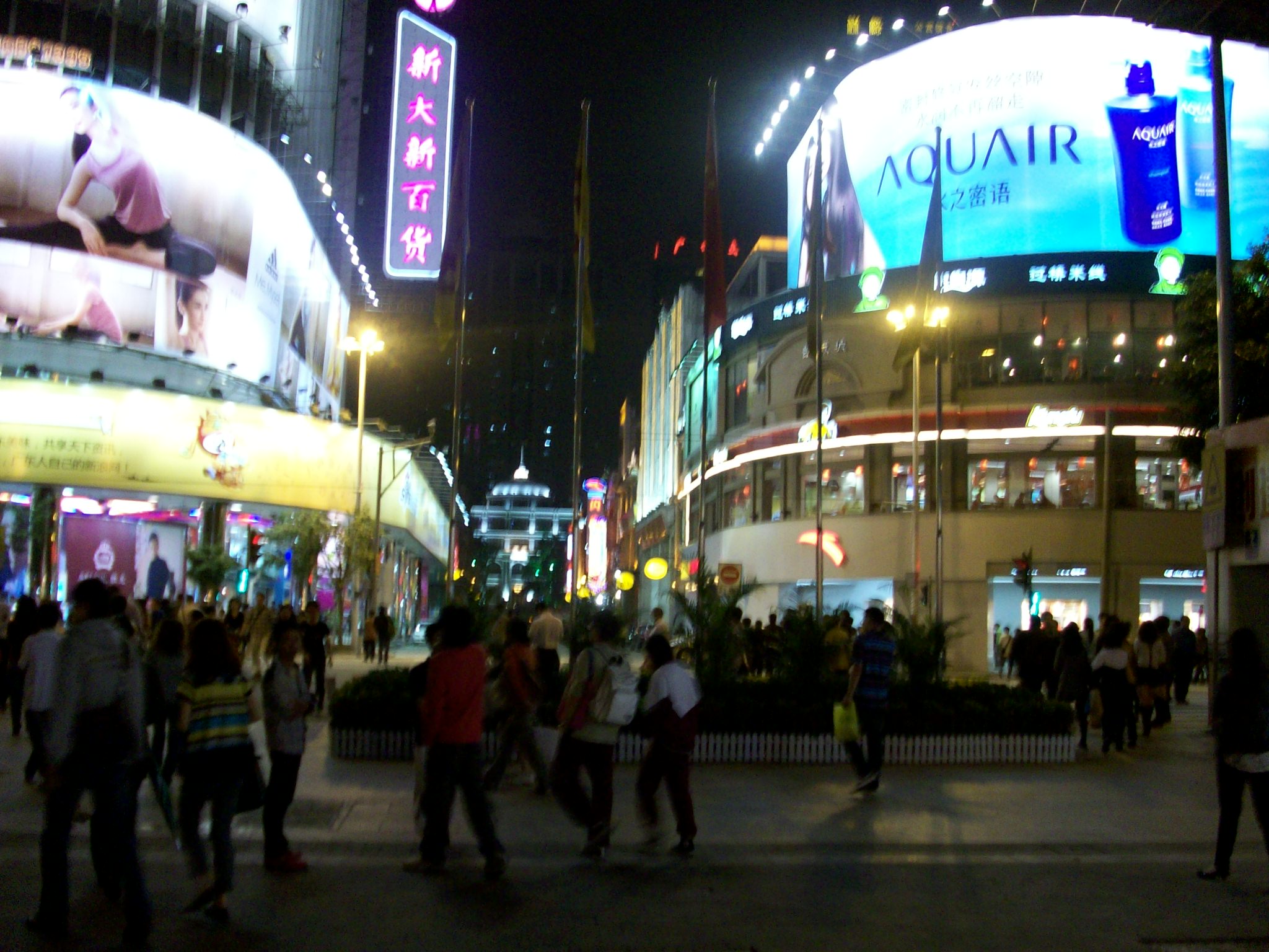 These are the neon signs of the two huge stores at the end of the pedestrian mall.