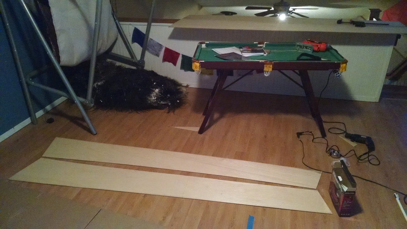 Side panels cut to size. The second one is traced from the first.