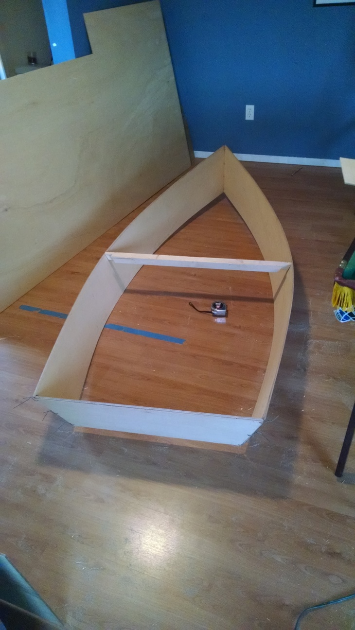 Sides and transom stitched together, and a 2"X2" cross beam giving it some shape.