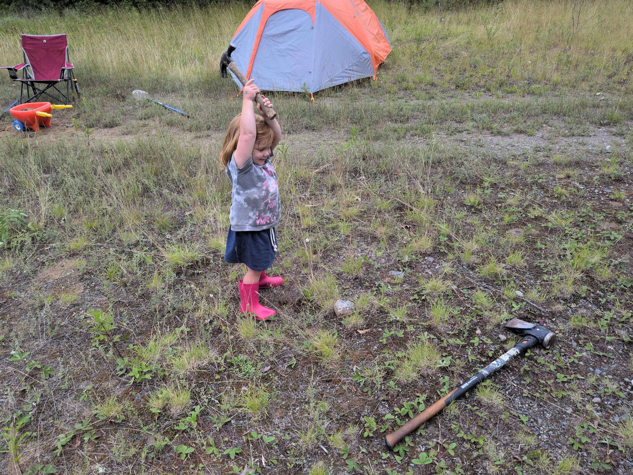 Riley breaking rocks.