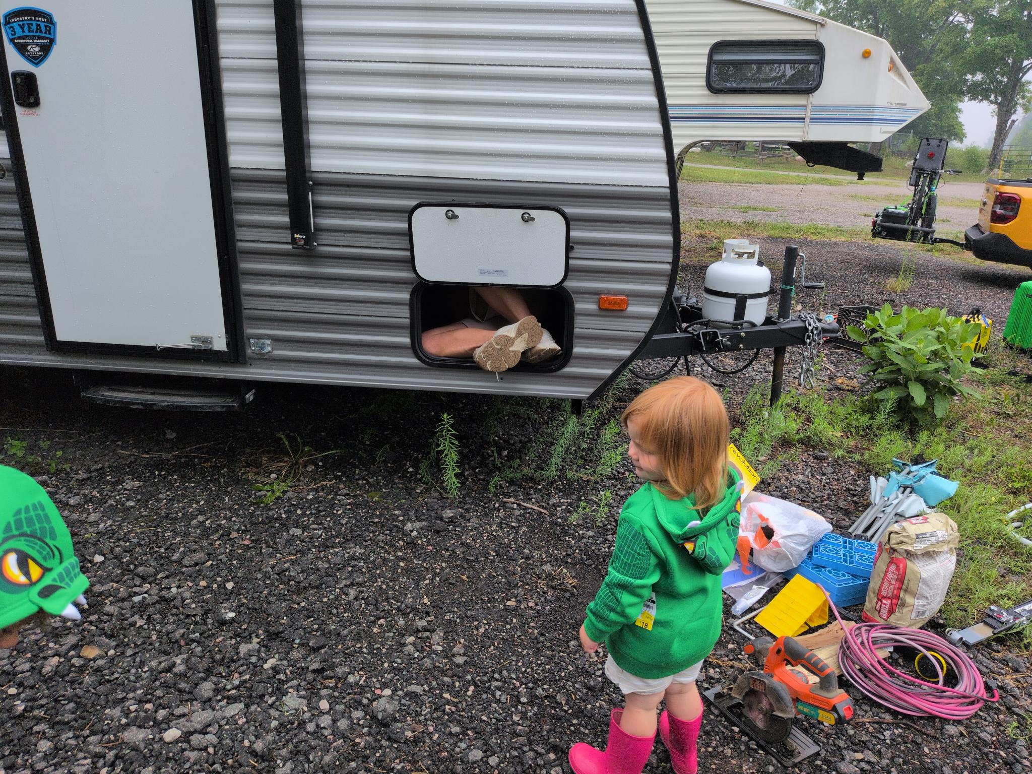 Breaking into the camper. Kids modeling their new sweatshirts.