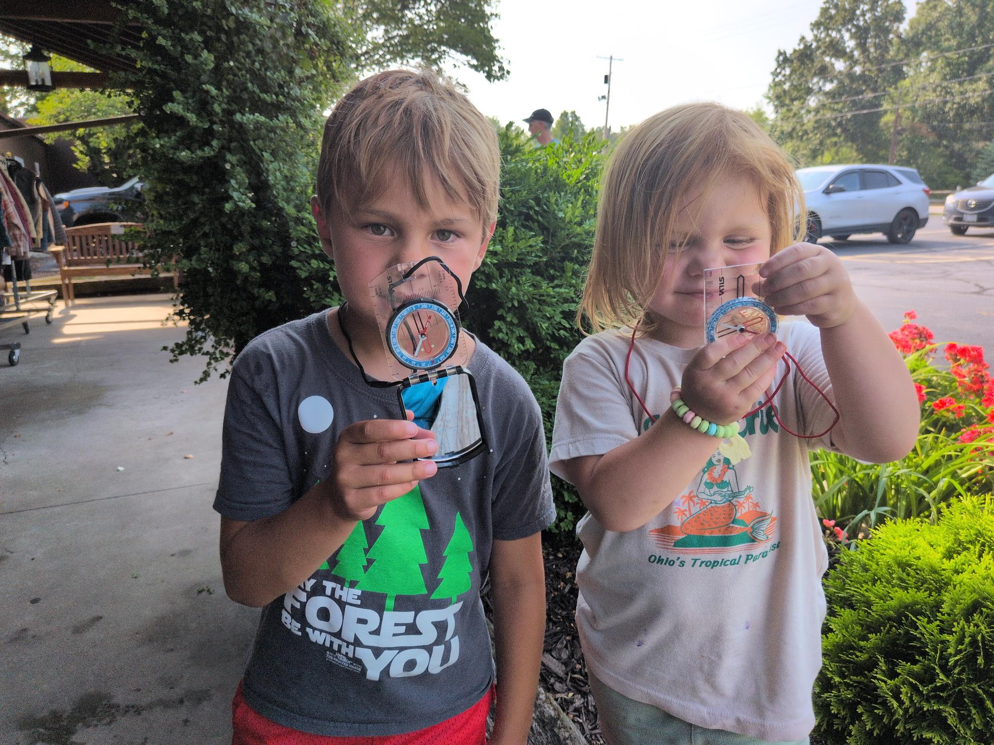 Kids with their brand new compasses at the backpackers shop