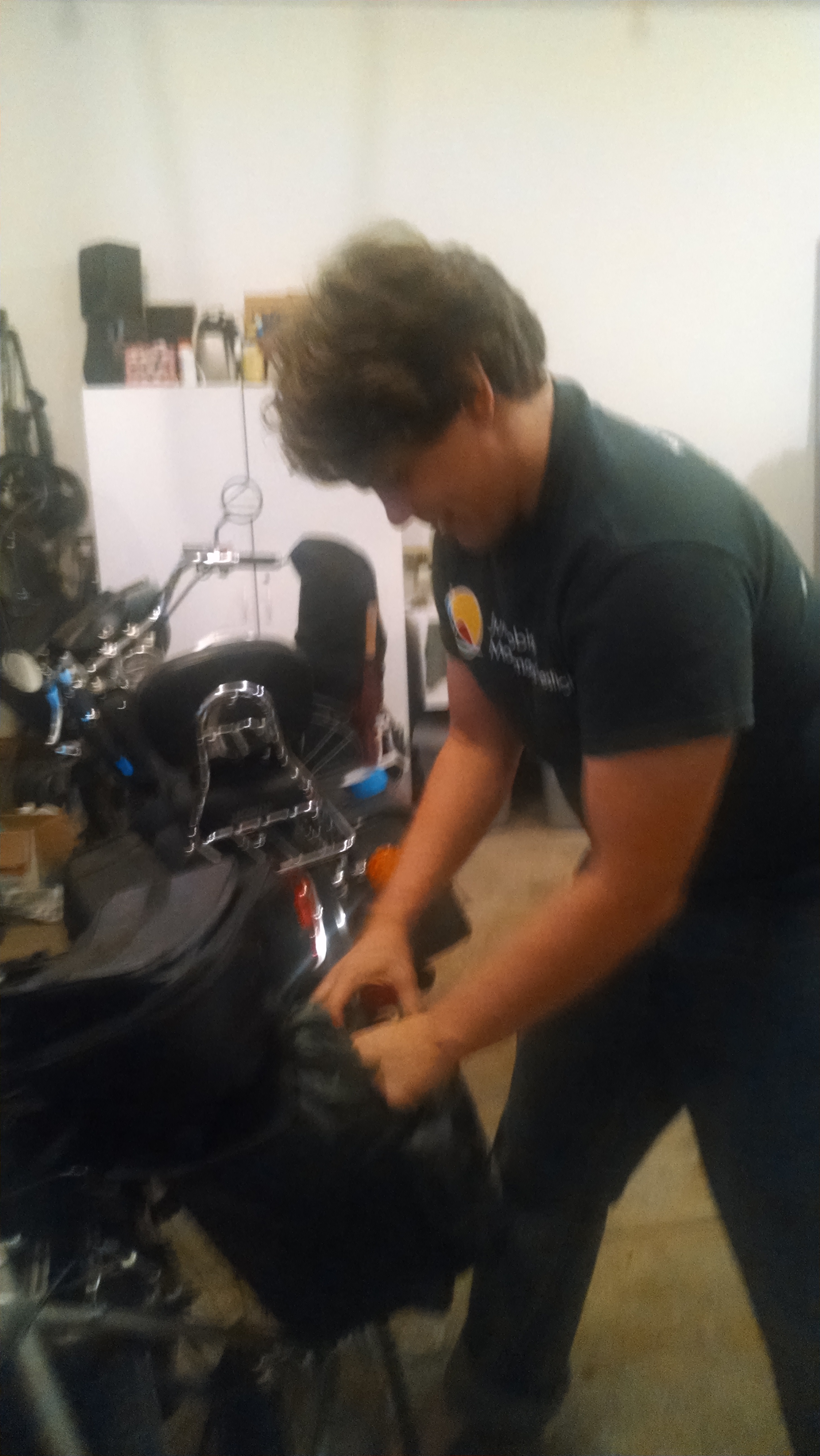 Cramming my tent and sleeping bag into the saddle bag.