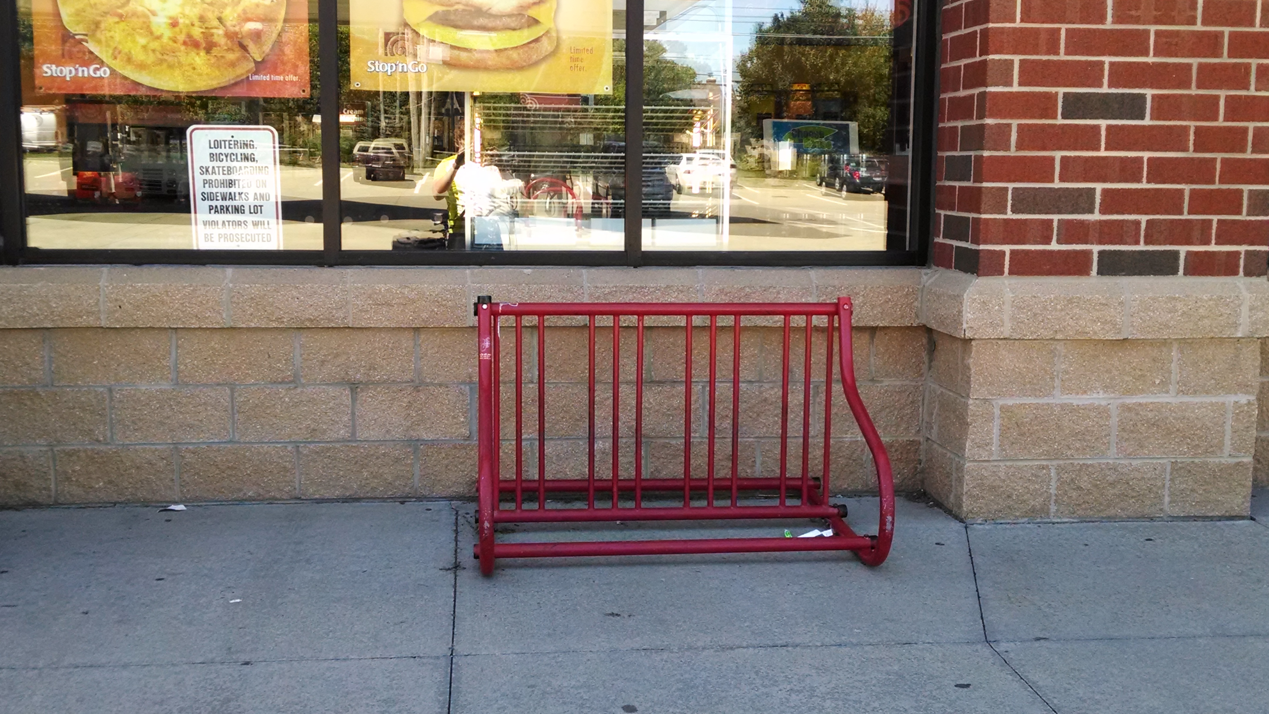 That&rsquo;s a weird sign to have next to a bike rack.
