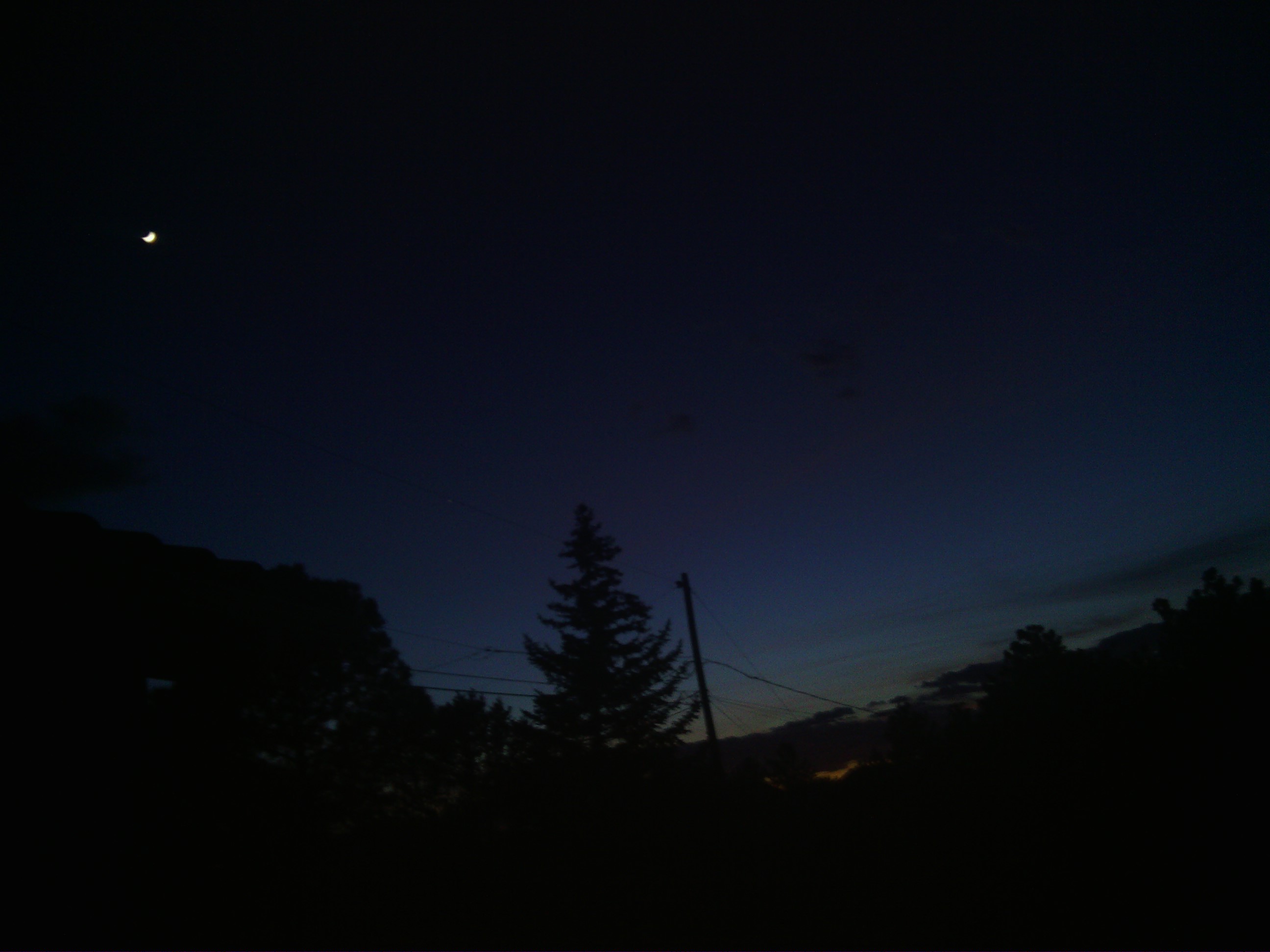 There was a cool subset and moon over the city today, but I was a little late snapping the picture.