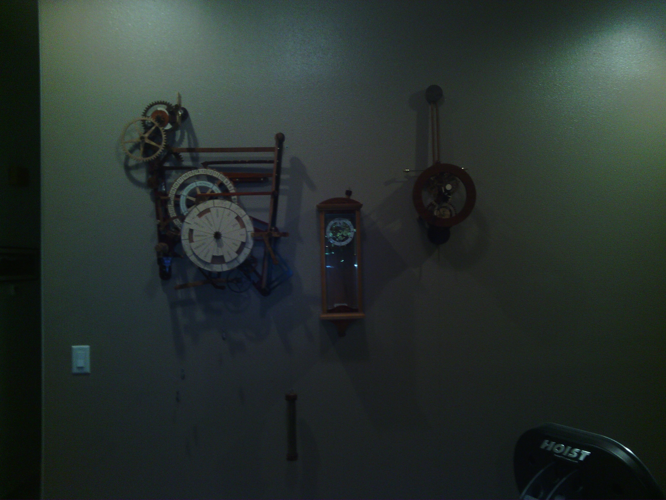Phil showed me how his various homemade clocks and kinetic sculptures work. The lighting really doesn&rsquo;t do them justice.