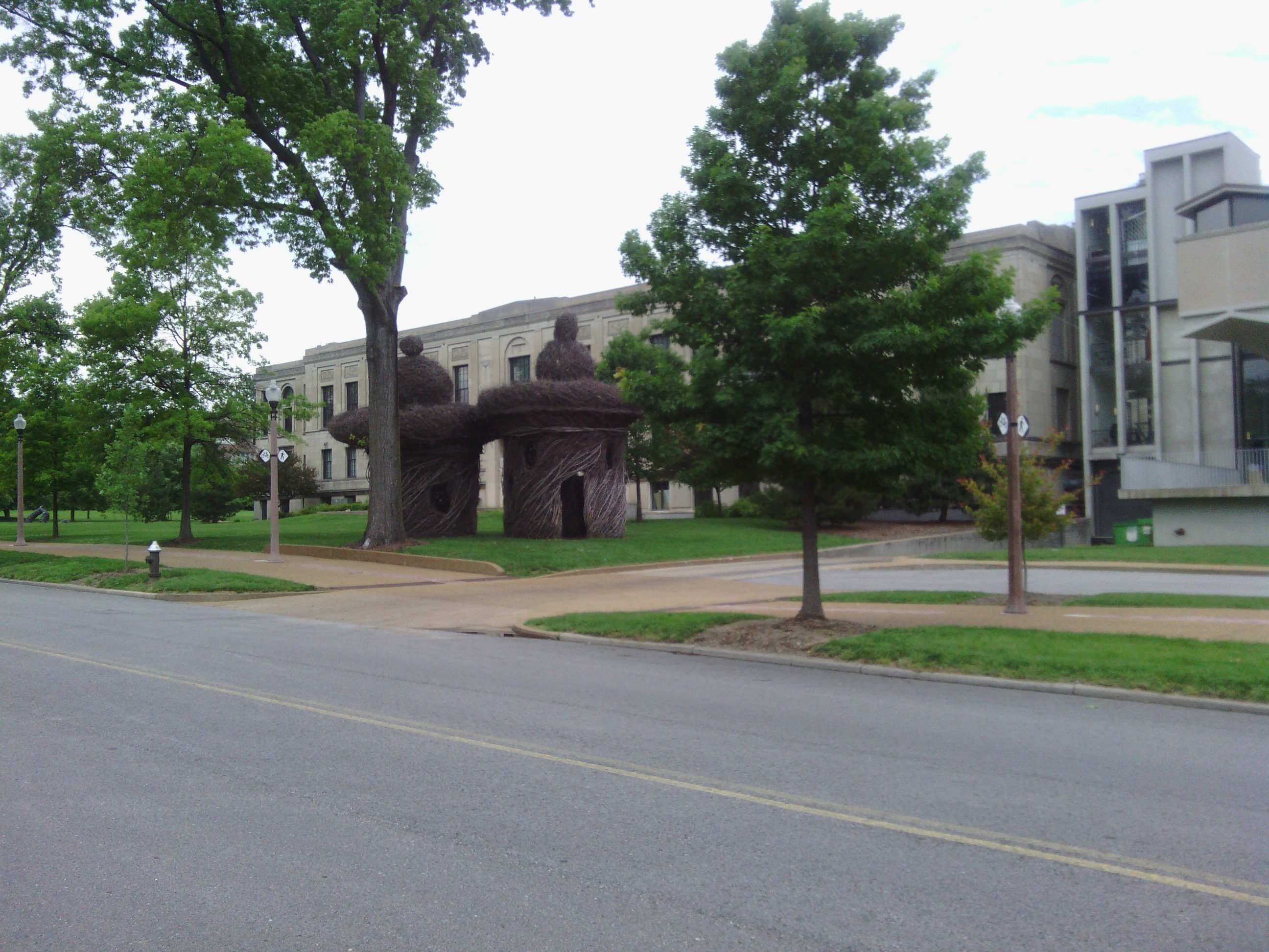 Some stick huts on campus