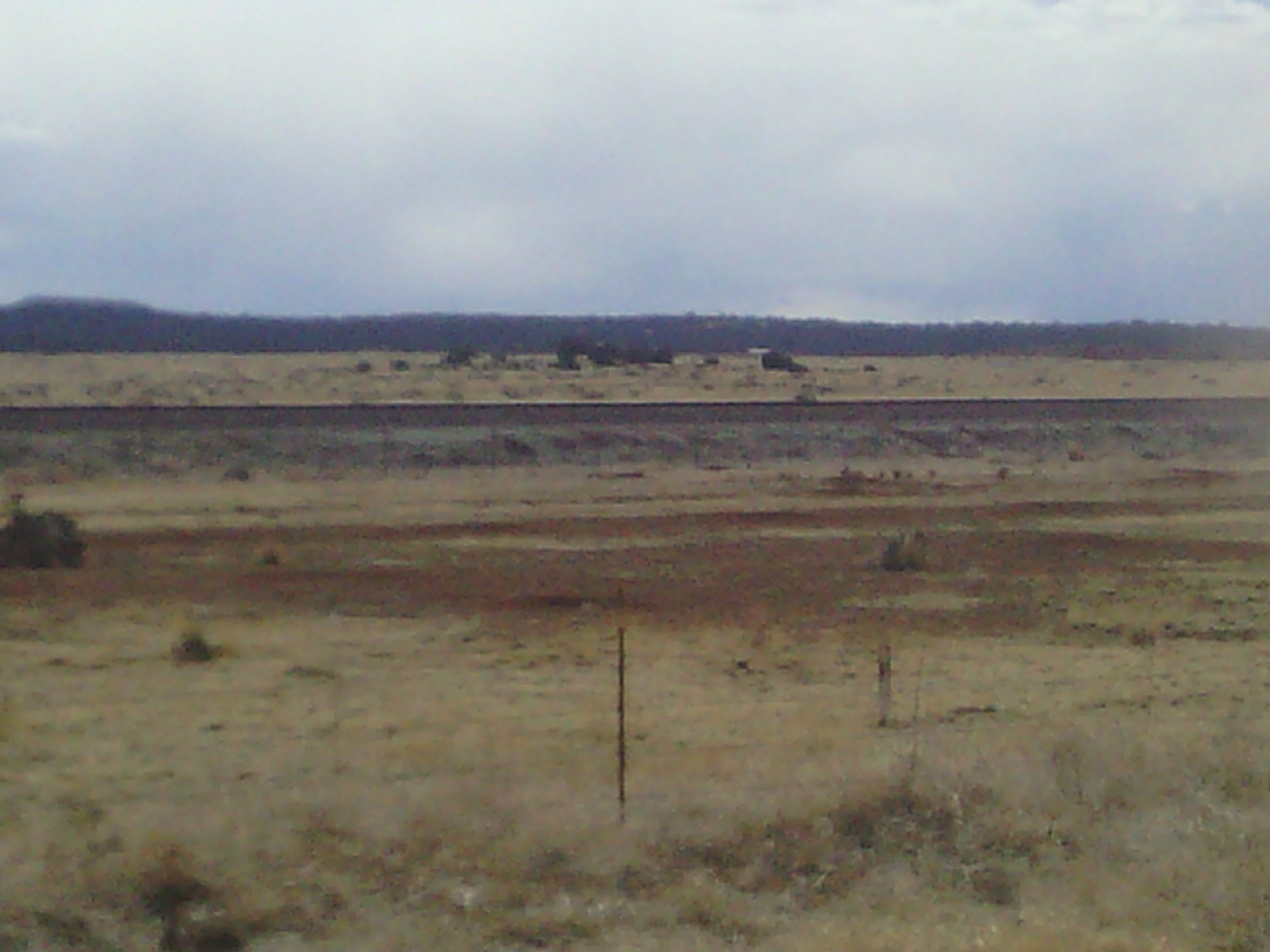 There was a dust devil right beside the road at my last water stop. I don&rsquo;t know if it shows up in the photo.