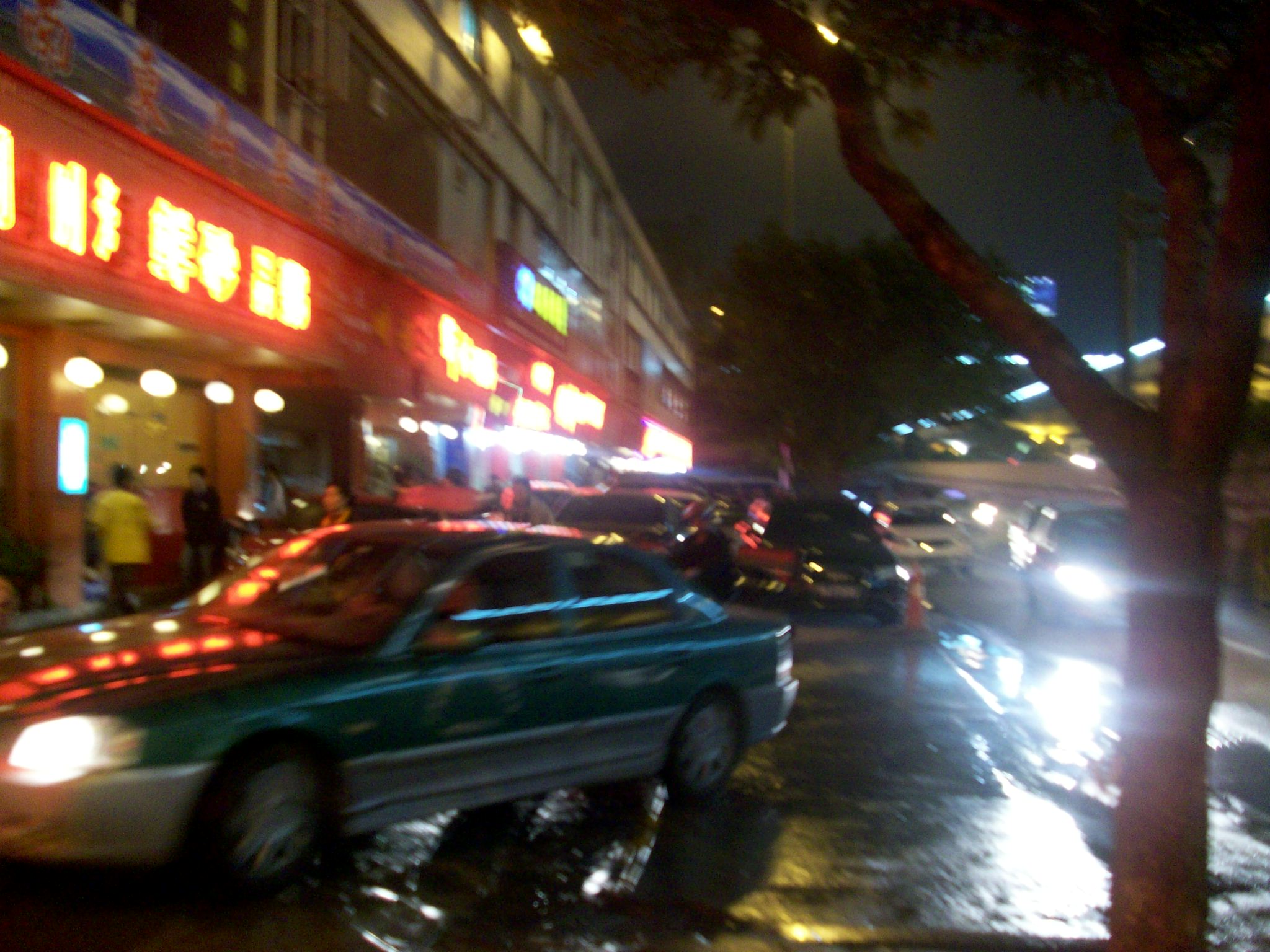 There is road construction so traffic is routed onto the sidewalk where restaurants have their tables set up.