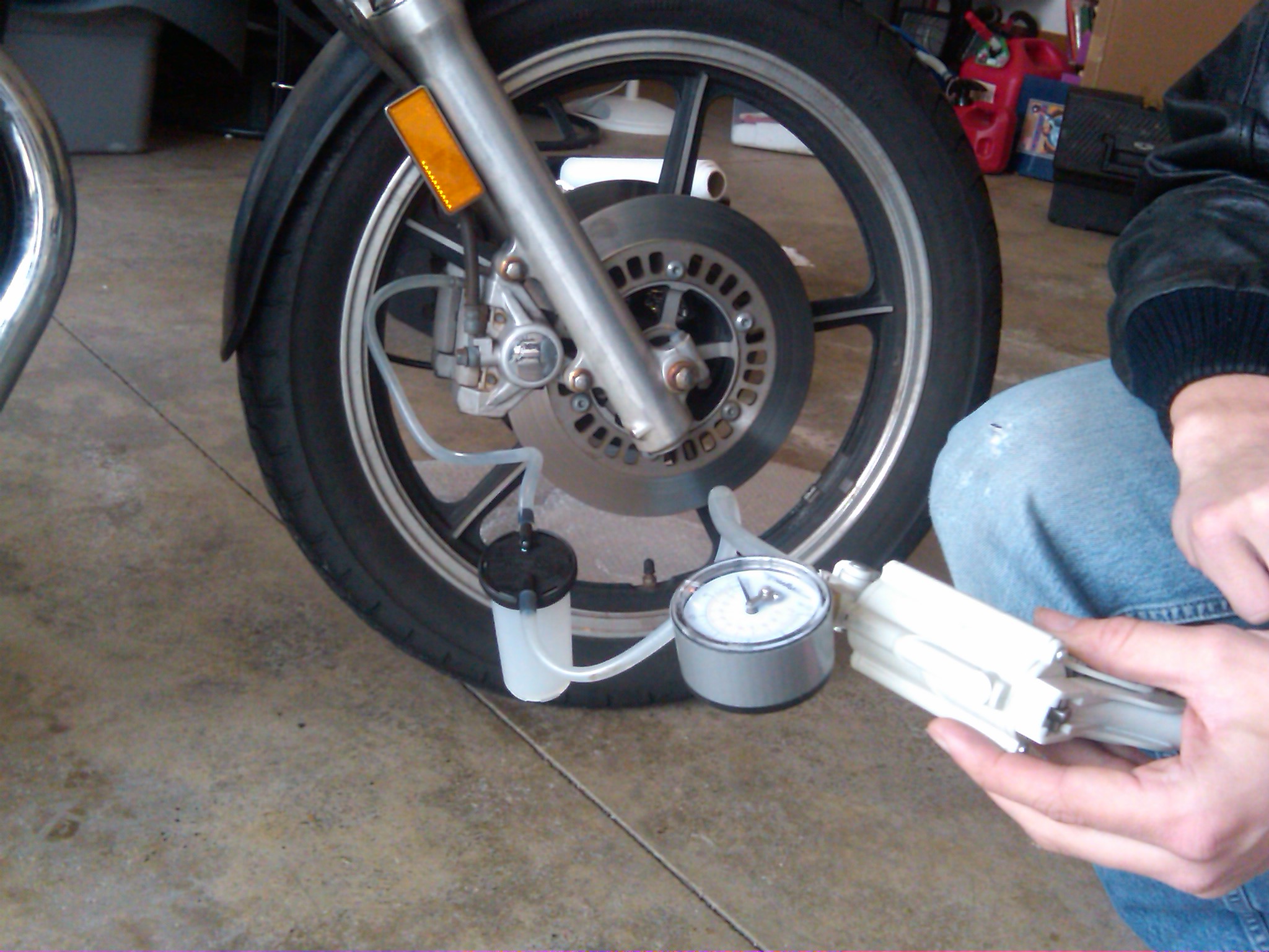 Vacuum set up and ready to pump.  Old brake fluid will be stored in the plastic jar as it is pumped out of the line.