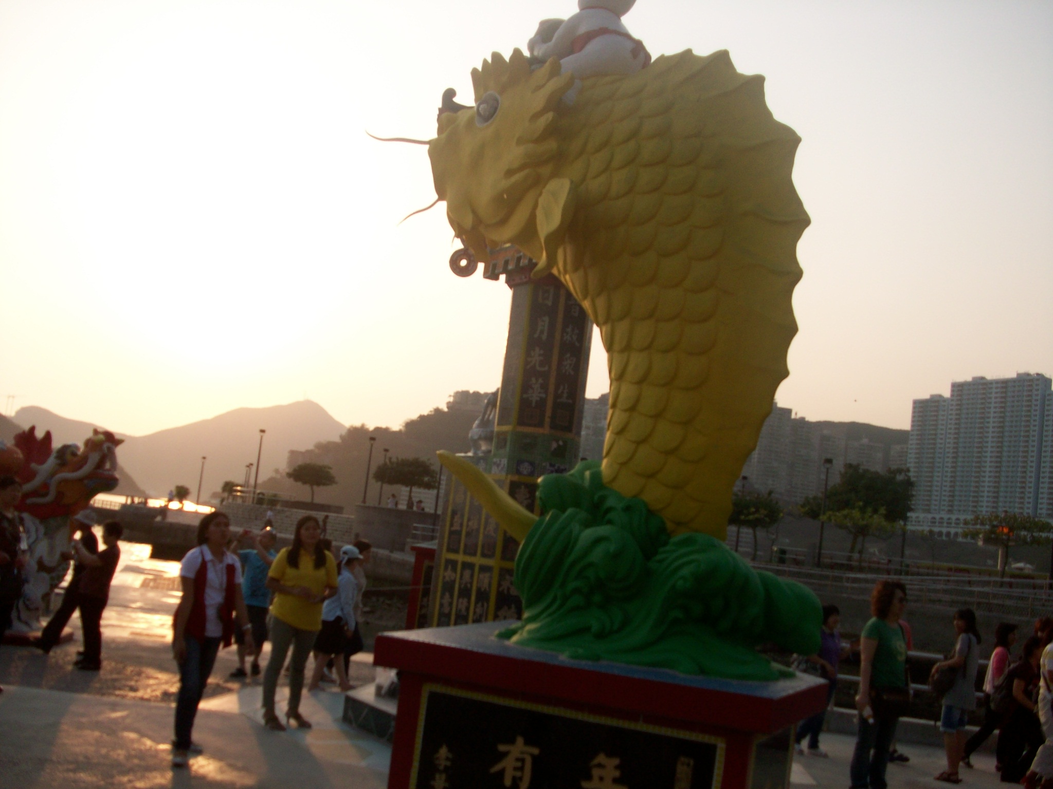 People were throwing (trying to throw) coins into the mouth of this fish statue for good luck.