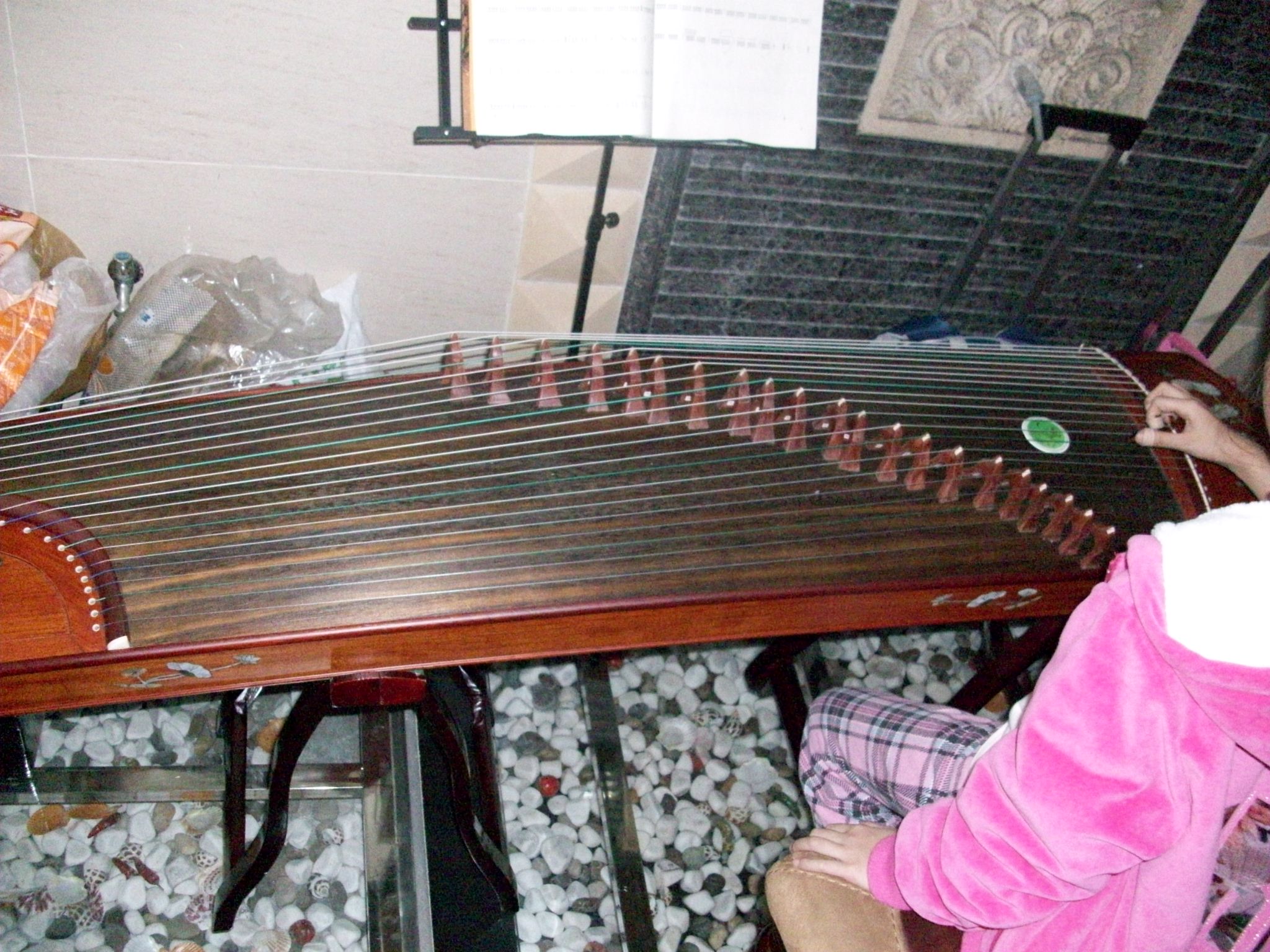This is a Chinese stringed instrument called a 古筝.  It sounds really cool.