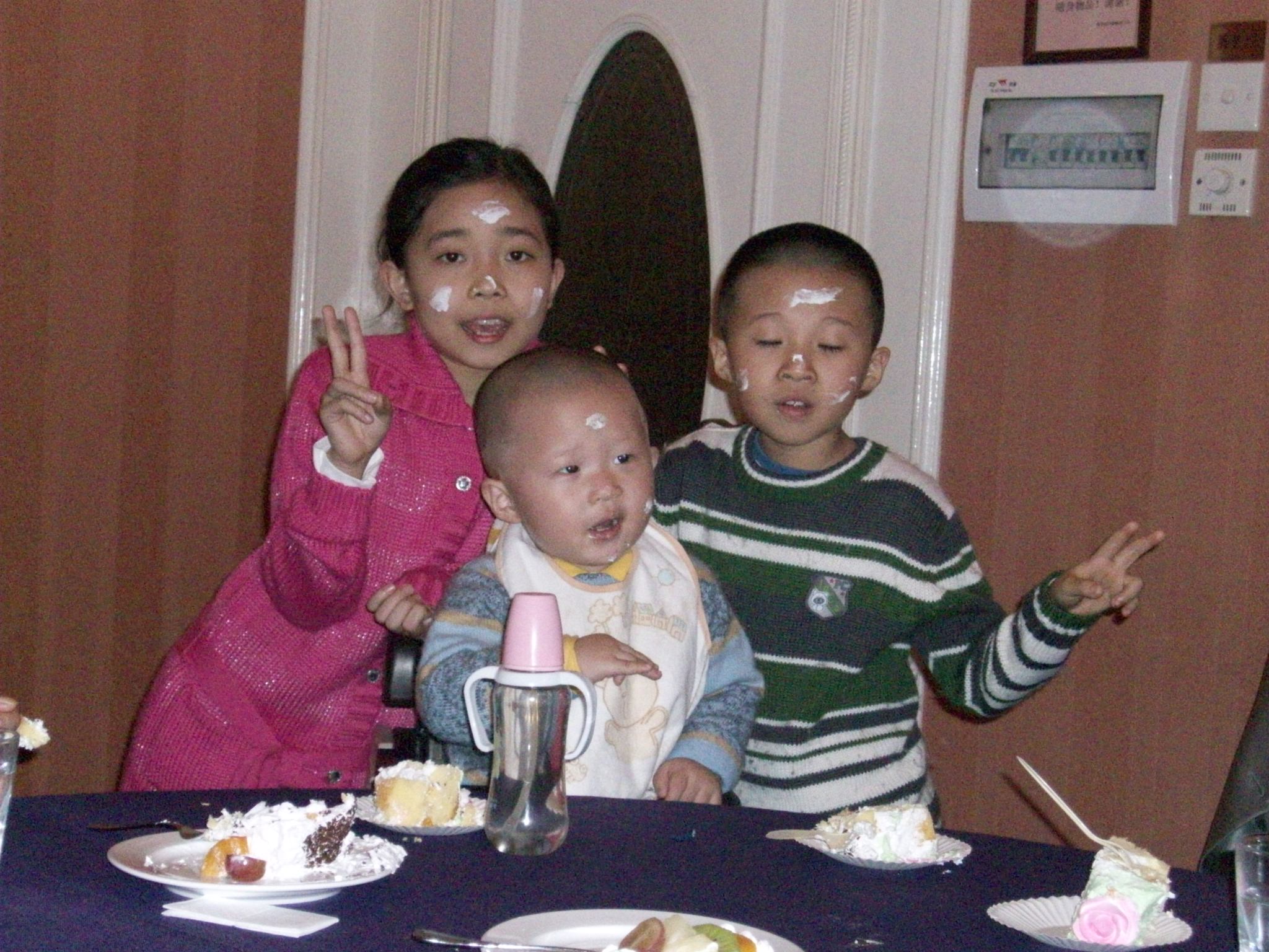 The two in the back are in my classes, and the young one up front is only two years old, but surprisingly good at english.