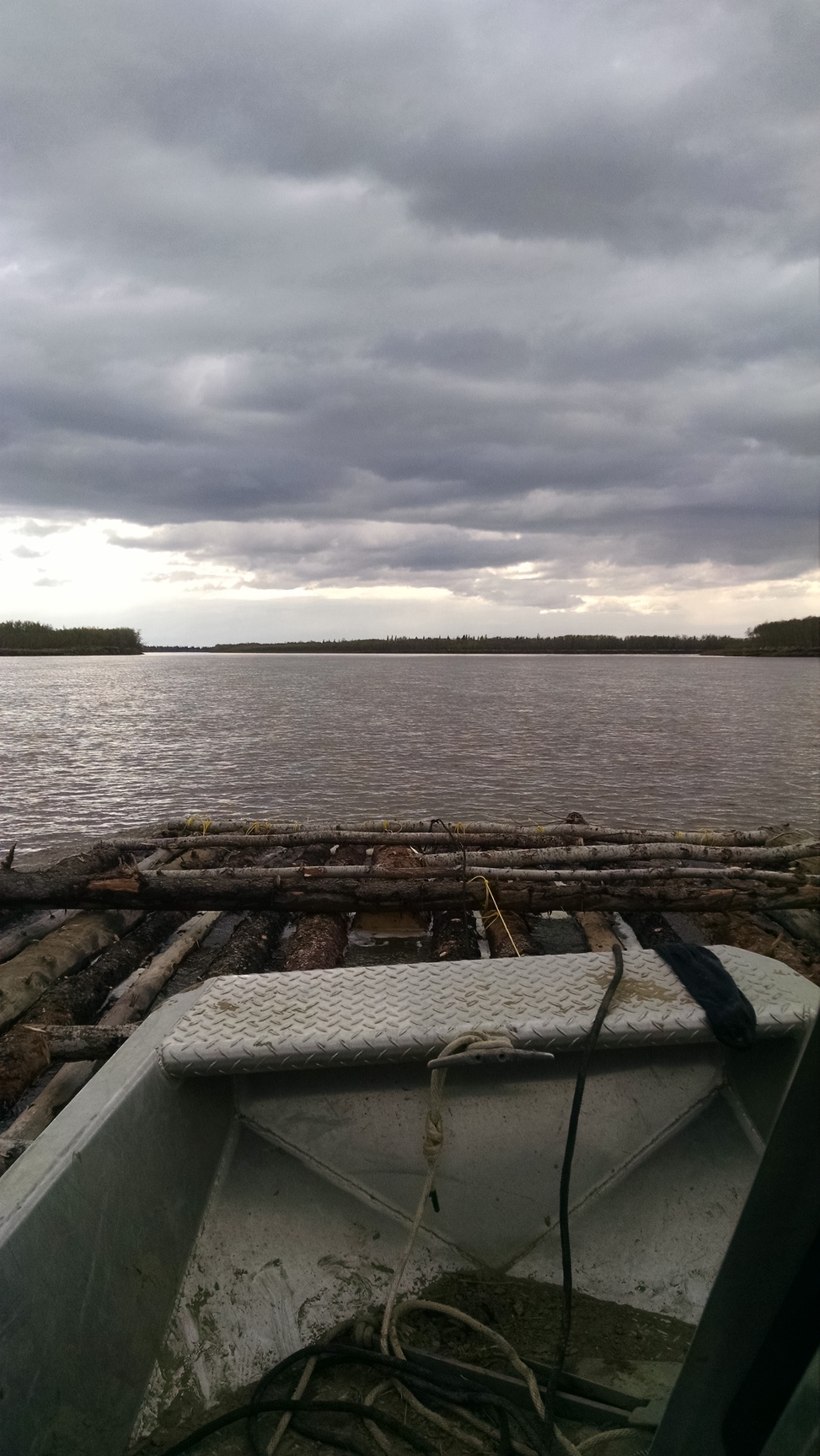 Pushing the initial raft downriver to another camp.