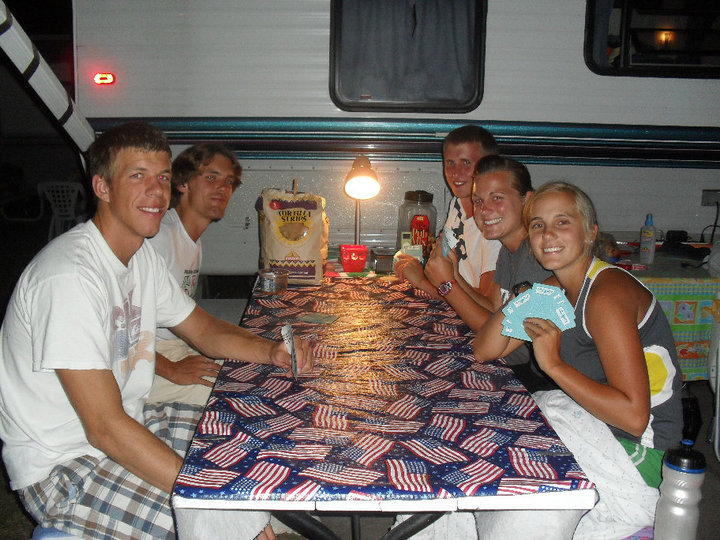 Playing cards outside the trailer.