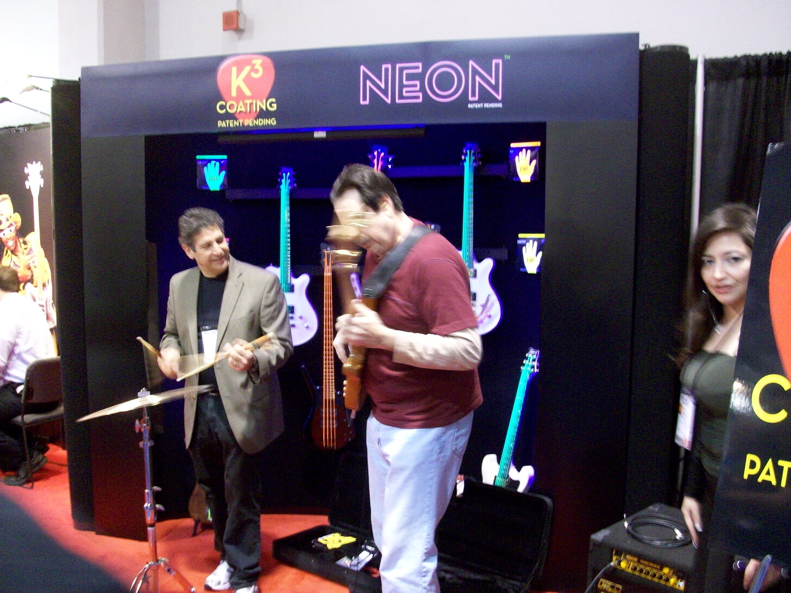 Check out the strings on those guitars on the rack in the background.