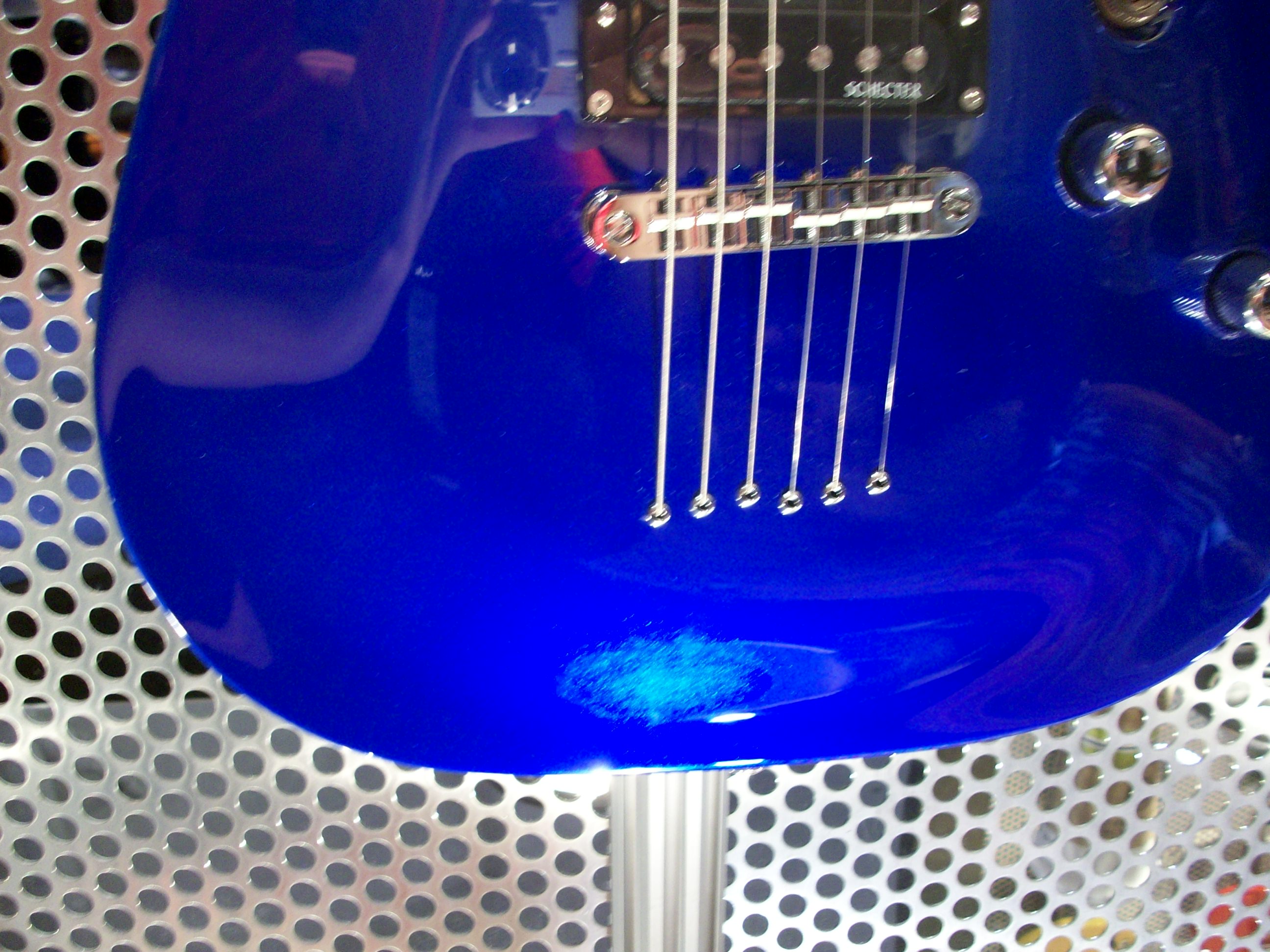 I like the bridge design on this guitar; especially the holes where the strings come out of the body.