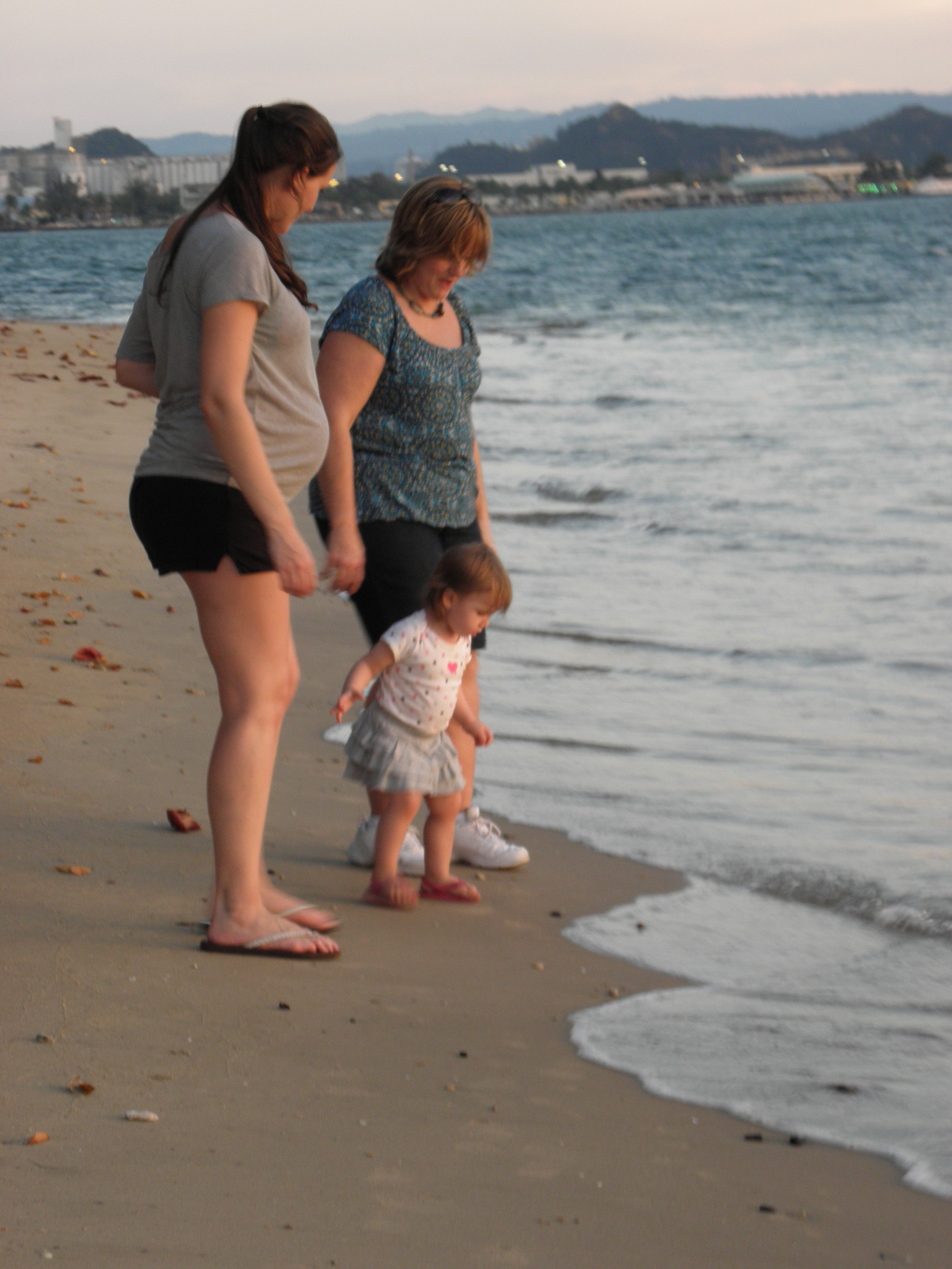 Mom, Beth, and Alayna walking on the beach outside Tyler&rsquo;s office.