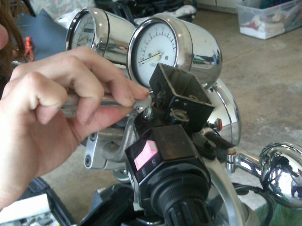 Cleaning the hole with a X-acto knife
