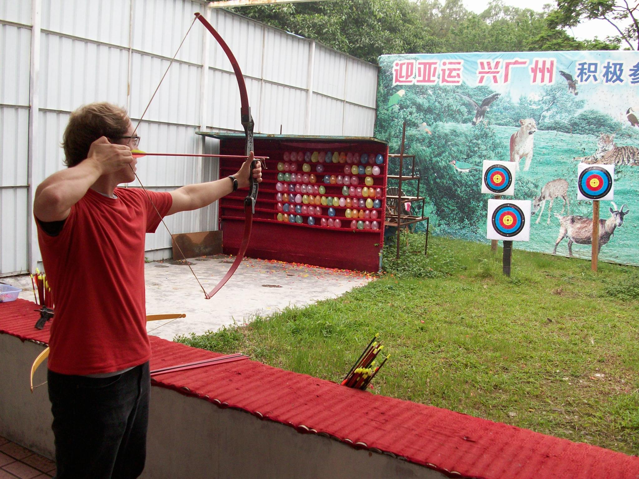 Brian showing off his archery skills using arrows without tail feathers.