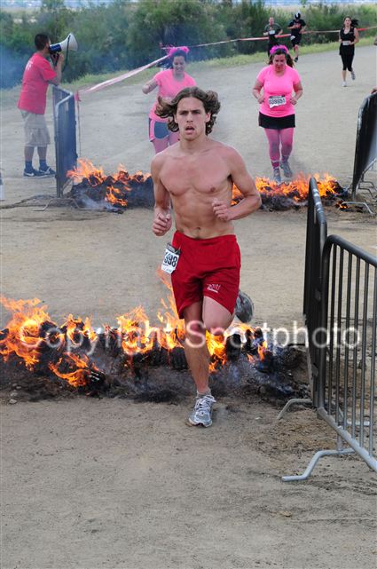 Jumping over the fire about a quarter mile before the finish