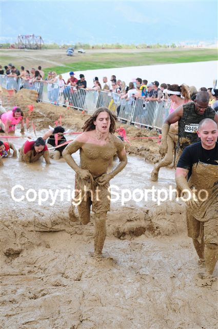 Holding my shorts up after they were weighed down by the mud